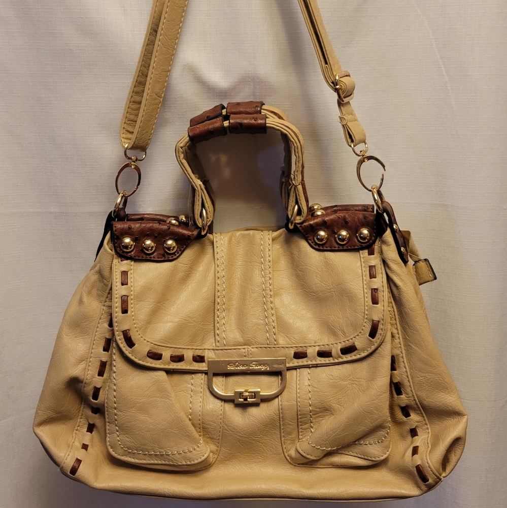 Lisa Fang hand/shoulder bag cream colored with brown handle embellishment.